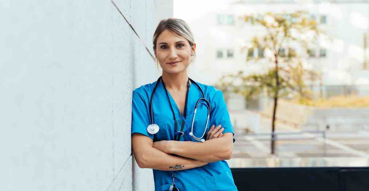 Nurse smiles, sharing how to find unplanned pregnancy help.