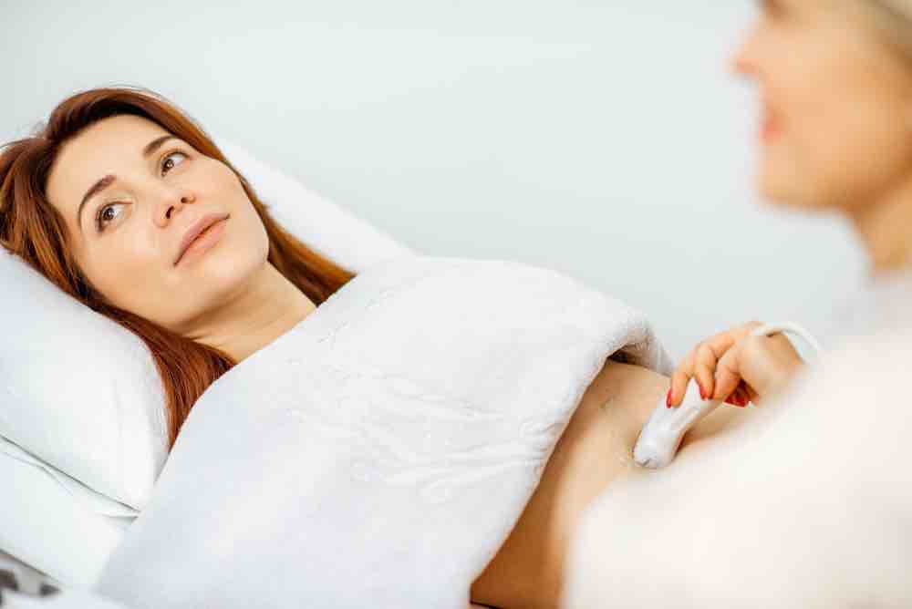 Woman having an ultrasound at a clinic.