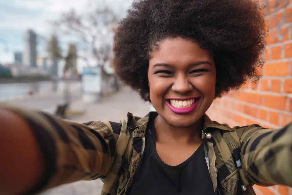 Afro American Latin woman confident that she has good information about finding a modern obgyn.
