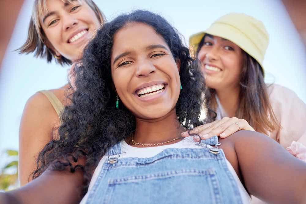 Selfie portrait of friends receiving support from an all about women obgyn.