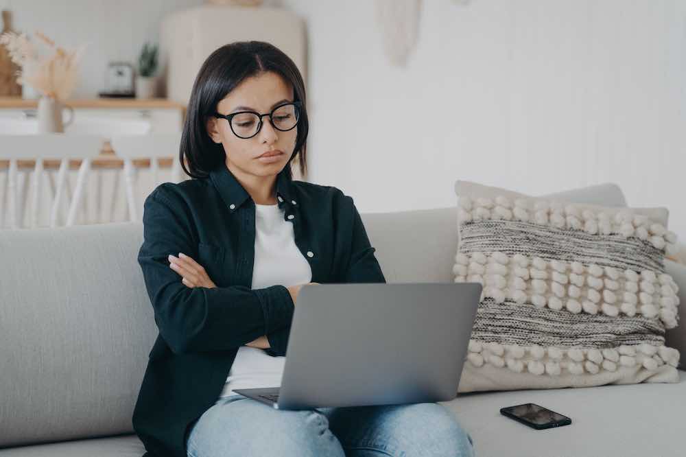 Skeptical businesswoman not getting answers about finding a modern obgyn.
