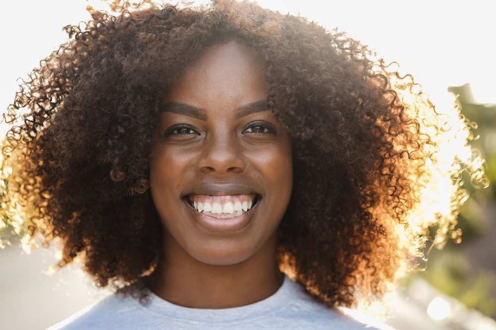 Woman confident in managing her PMS symptoms.
