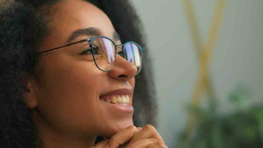 Closeup of woman with glasses asking how long do STD results take, and where can I be tested?