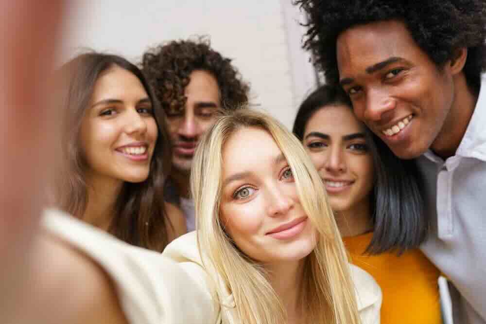 Happy diverse friends getting free STD testing Metro East.