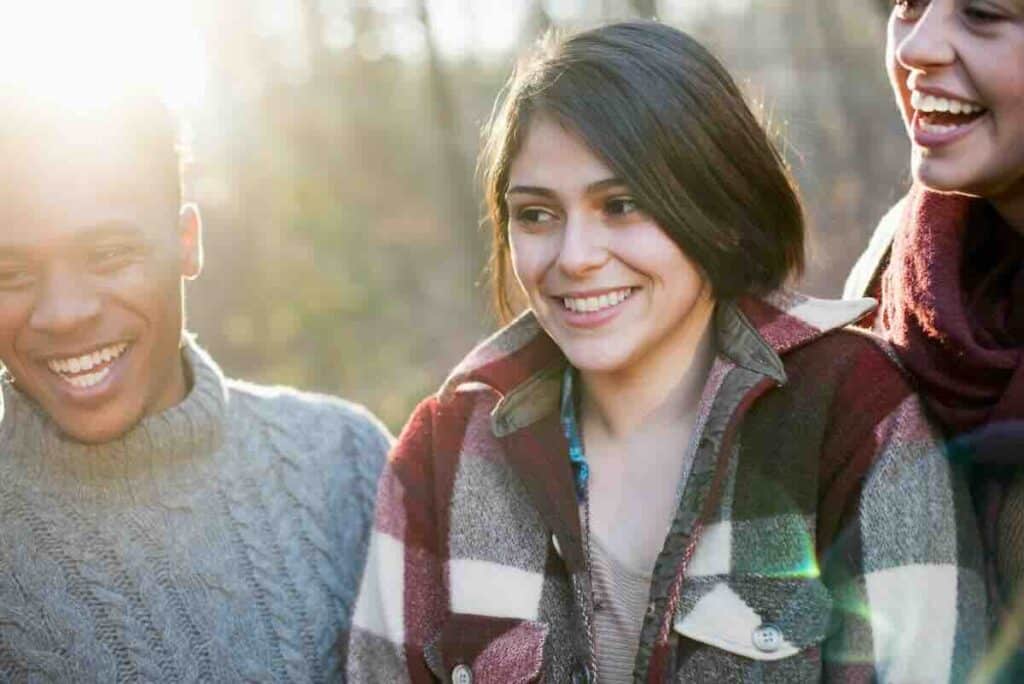 Three friends outdoors asking where can I find free STI testing Metro East