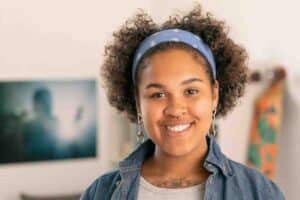 Woman wearing a headband with piercings and tattoos asking How common is syphilis in Missouri?